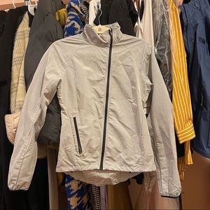 Nike asymmetrical zipper running wind jacket. Size XS. Gray/grey